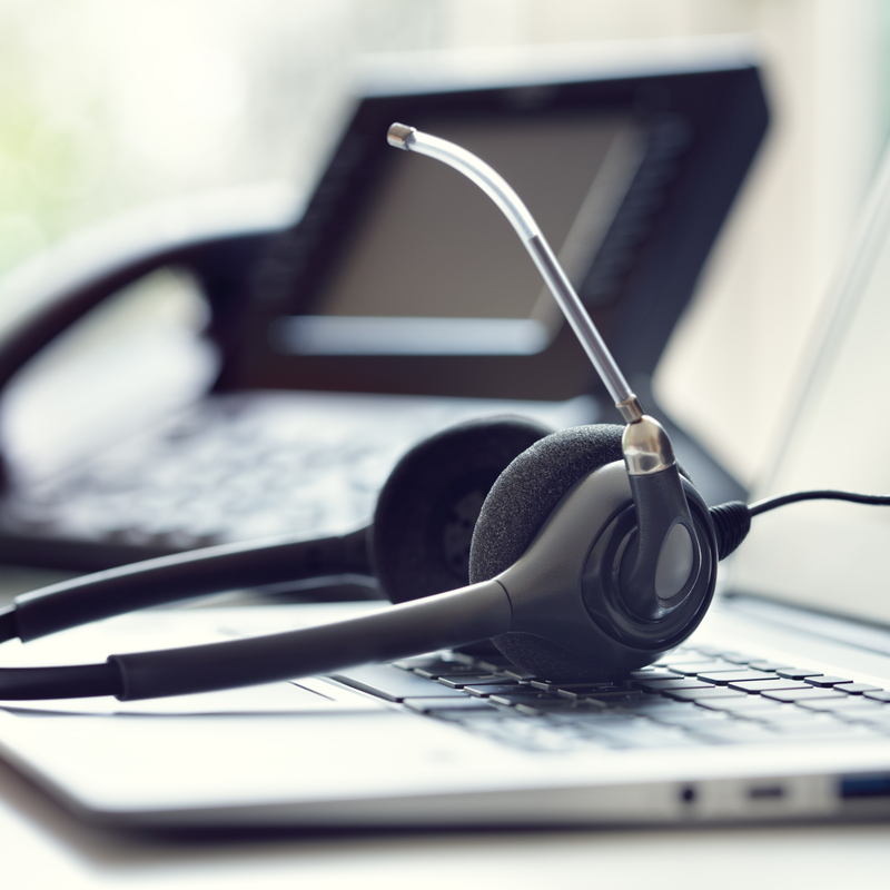 VOIP phone and headphones in a boardroom